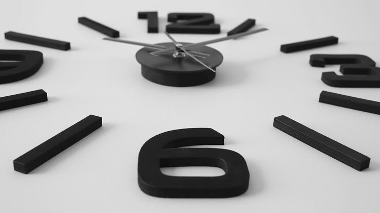 The moving second hand of the clock