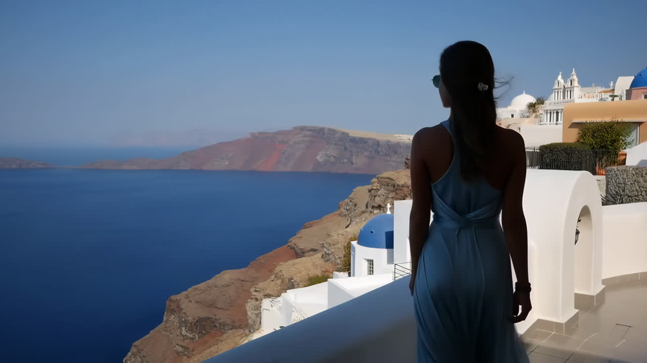 Woman enjoying the scenic view of Santorini, Greece