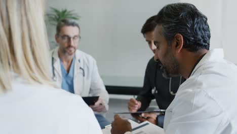 doctors sit talking in a meeting 4k