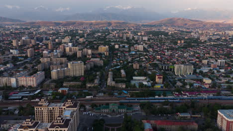 dense city of bishkek at sunrise in kyrgyzstan, central asia. aerial drone shot
