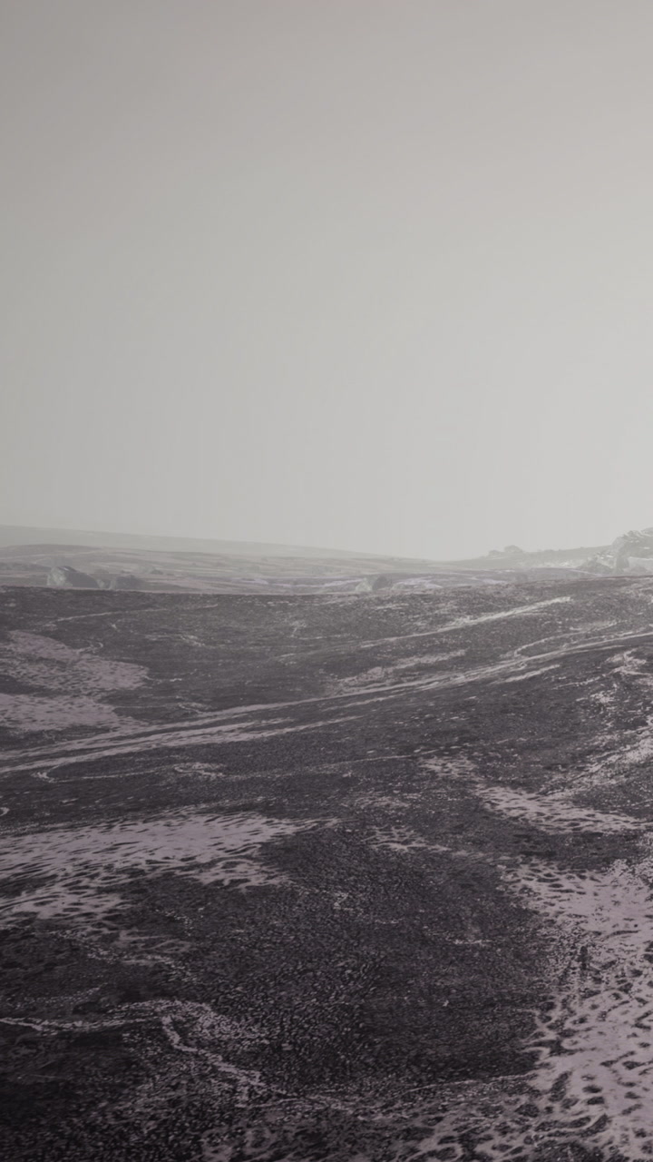 Landscape view of rough terrain with fog and mist in a remote area