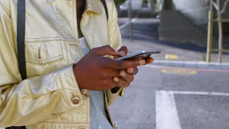 woman using mobile phone in city street 4k