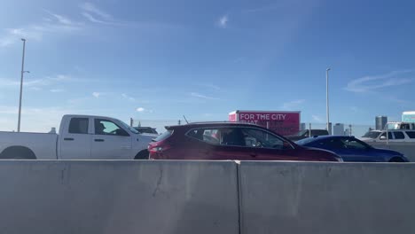 view from a moving vehicle on the nyc highway interstate road with other cars and trucks