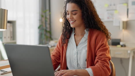 Business woman, smile and typing with laptop