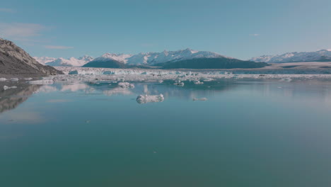 aerial flying over a frigid lake in the breathtaking alaskan wilderness