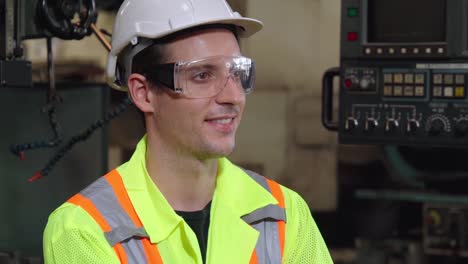 Young-factory-worker-or-engineer-close-up-portrait-in-factory