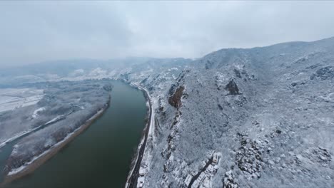 slow ascending fpv shot of wachau valley during dreamy winter time