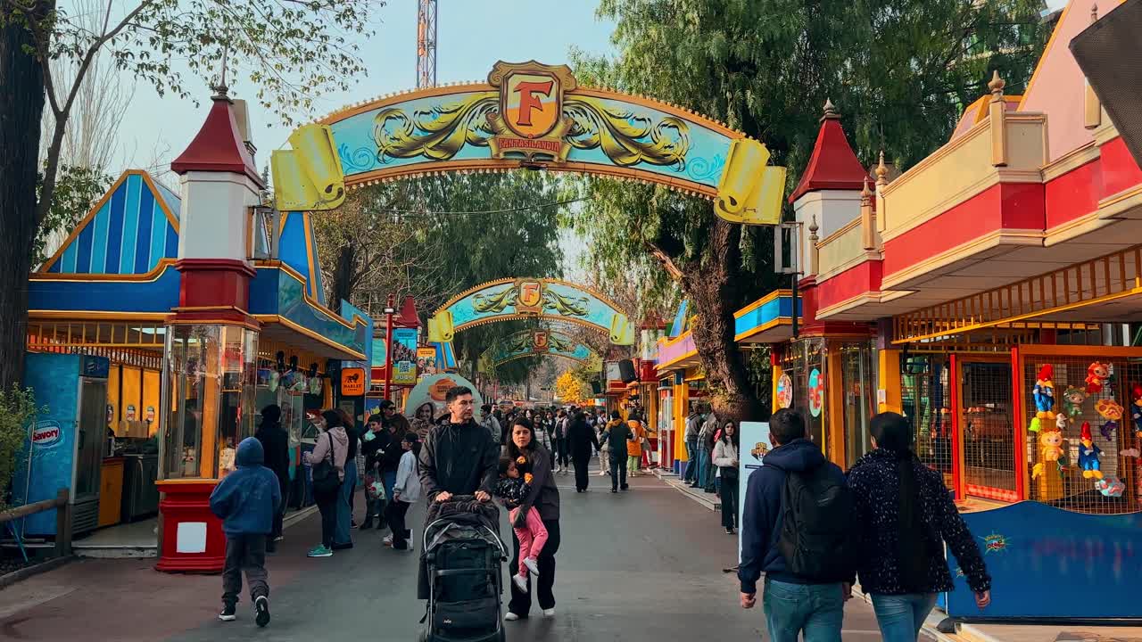 Open view of the arches of Fantasilandia, a family amusement park in Santiago, Chile. People enjoying the spring