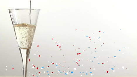 animatie van confetti dat over een champagne glas valt