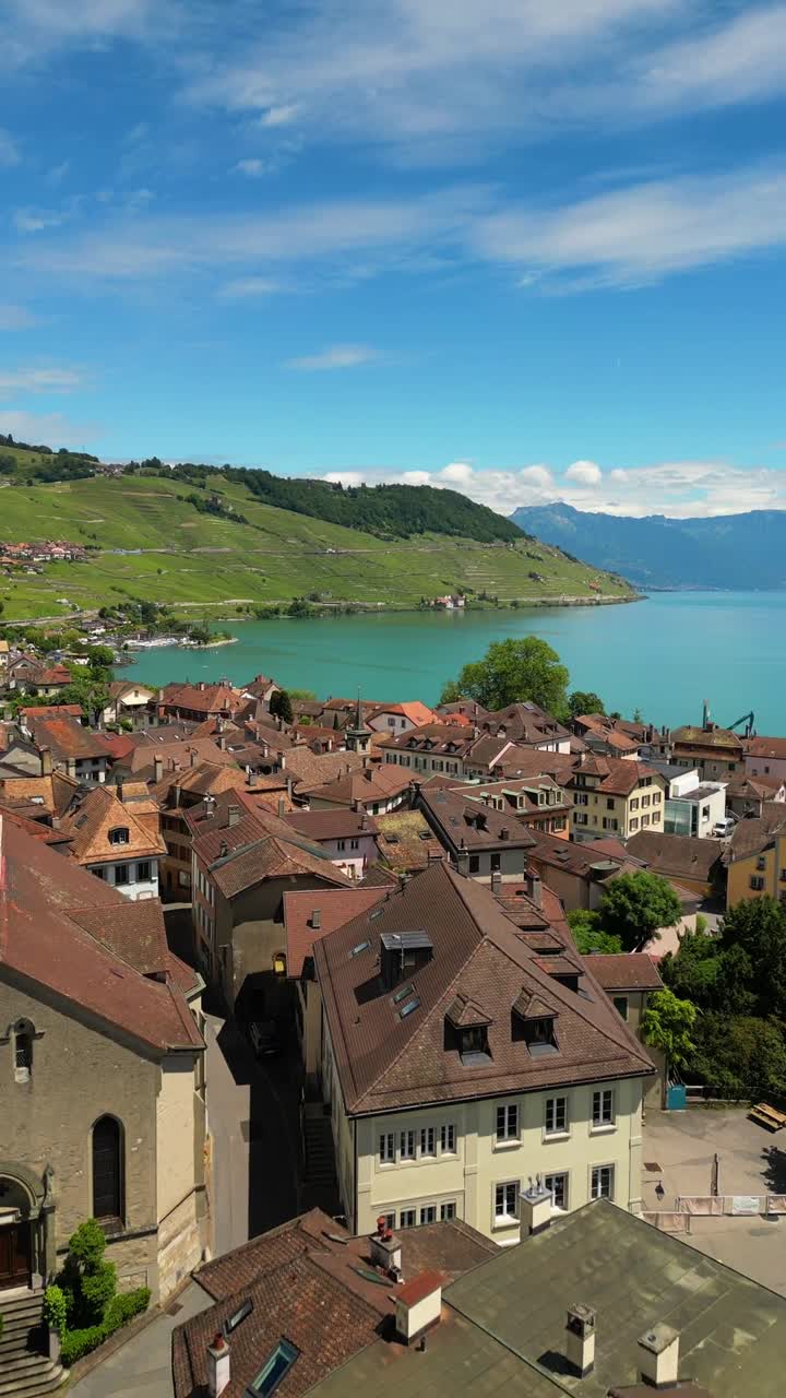 Lavaux region medieval town Switzerland Lake Geneva shoreline, aerial above houses roof