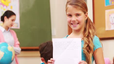 Pupil-showing-her-work-to-camera