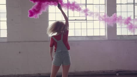 Fashionable-young-woman-in-an-abandoned-warehouse