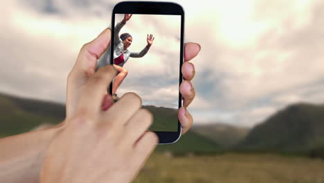 hand showing running and adventure clips on smartphone