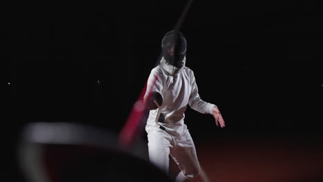 a fencer in action during a competition