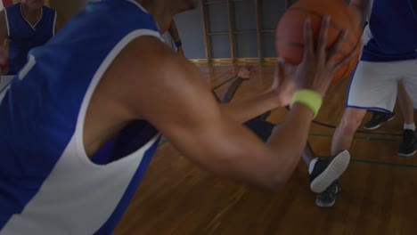 Group-of-diverse-team-of-male-basketball-players-playing-basketball-in-the-court