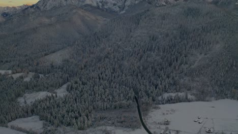 Aerial-View-Of-Snow-covered-Forest-And-Tatra-Mountain-Range-In-Europe