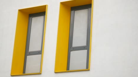 modern building with yellow framed windows