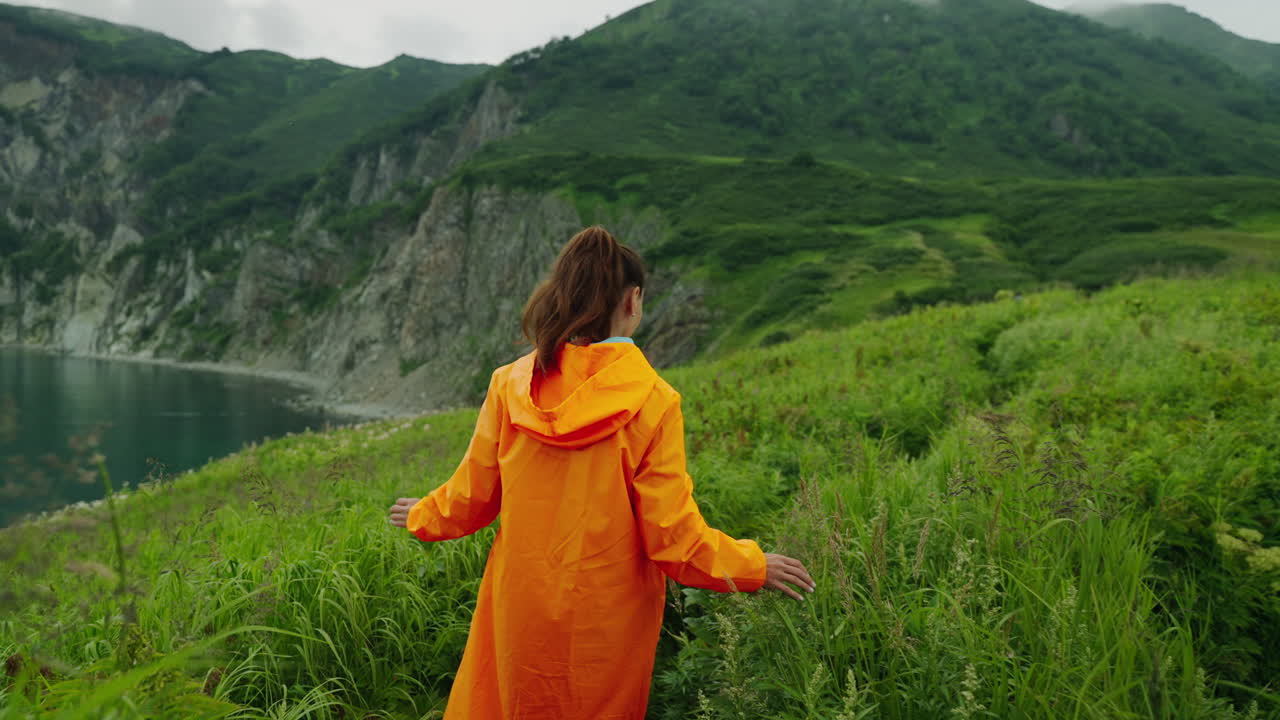 Woman hiking in the mountains by the sea