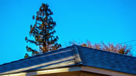 close up rooftop with car headlights beaming onto the roof casting shadows