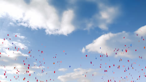 animation of multi coloured confetti falling over blue sky and clouds