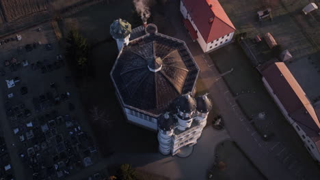 drone shot of a church in the early morning in a small village