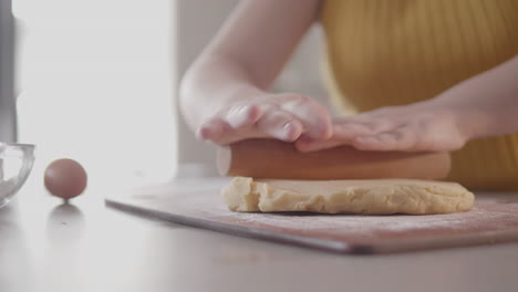 starting to roll out a pie dough in a home kitchen