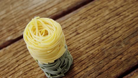 close-up of green and yellow fettuccine