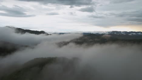 flight over mist cloud over mountain terrain at sunset costa rica, 4k drone