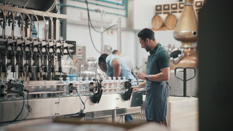 factory workers bottling beverages