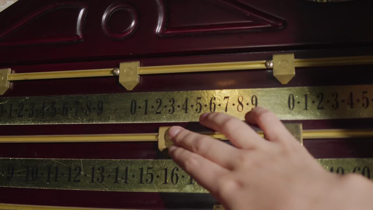 Old scoreboard with a score in billiards. Playing american russian billiard game. High quality 4k footage