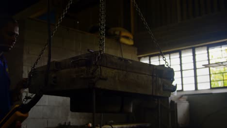 overhead crane machine carrying mold in workshop 4k