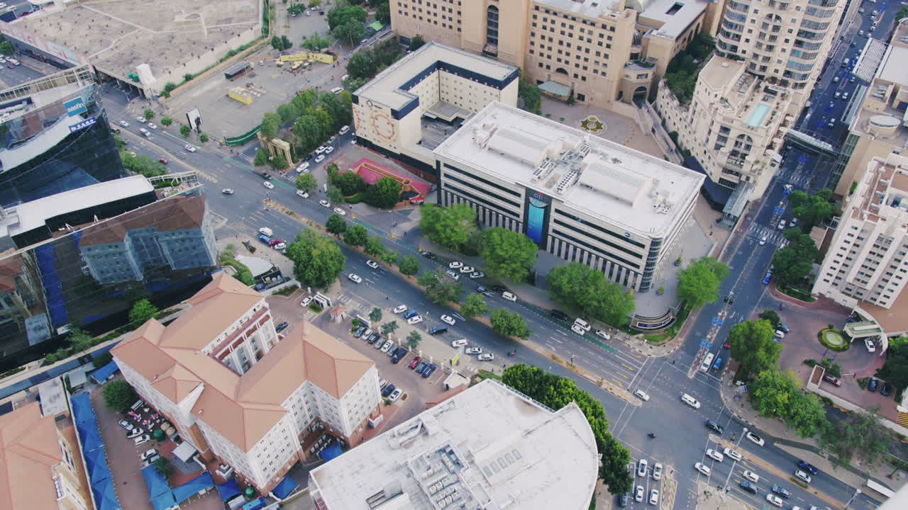 Aerial Top-Down View of Sandton, South Africa – Bustling Traffic, Skyscrapers, and Urban Energy from Above