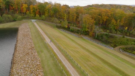 Aerial-shot-of-bicycle-trail-rider-at-local-reservoir