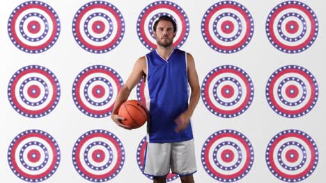 caucasian male basketball player holding basketball against multiple stars on spinning circles