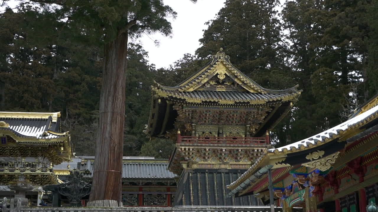 Slow pan left of the Yomeimon Gate and surrounding structures, Toshogu Temple, Nikko, Tochigi, Japan.