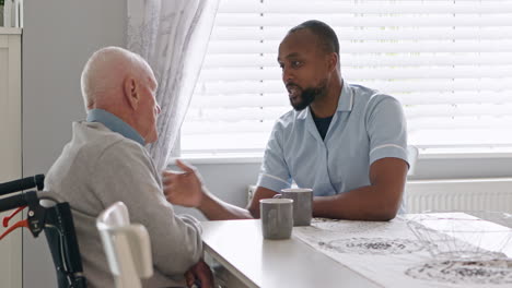 elderly caregiver comforting senior man