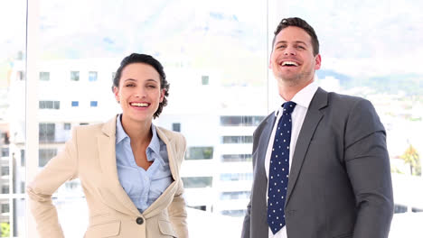 smiling business partners putting their hands together