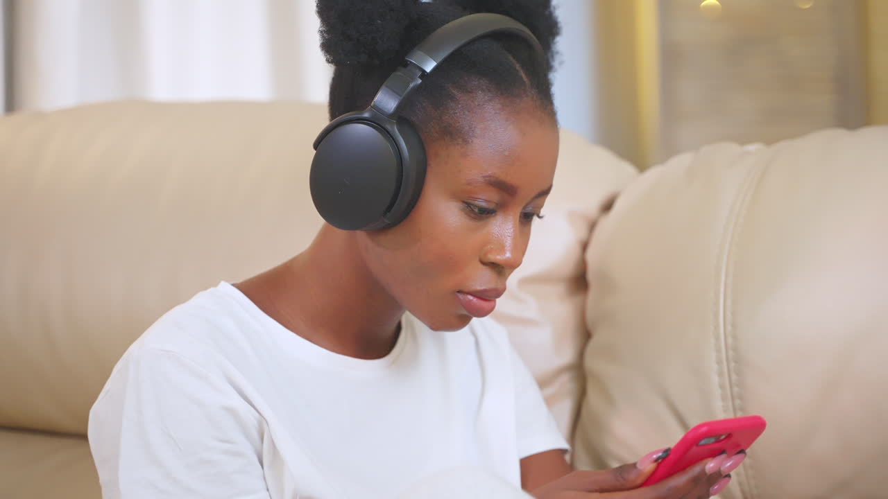 Woman Listening to Music and Using Phone