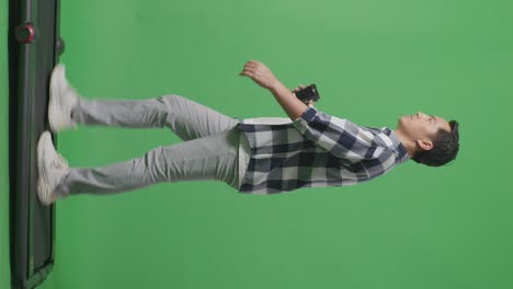 side view full body of asian man walking and drinking coffee on green screen background