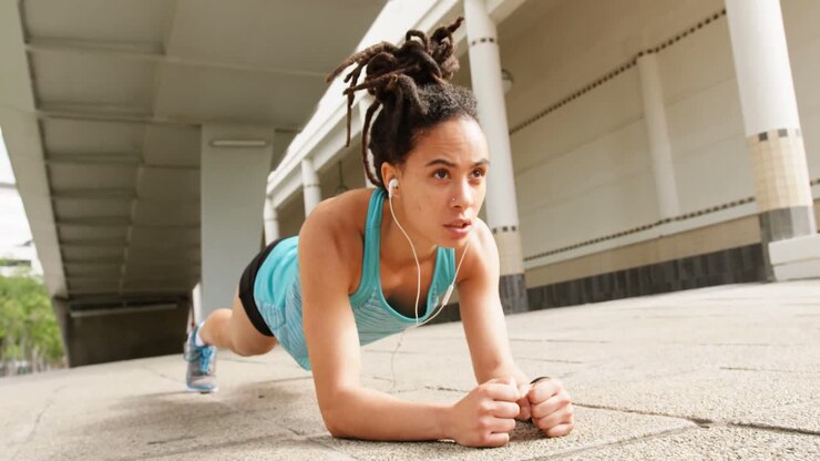 Front view of young African American woman exercising in the city 4k