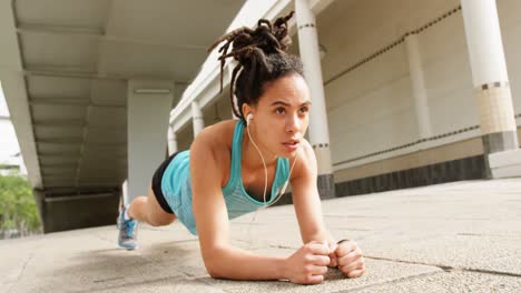 front view of young african american woman exercising in the city 4k