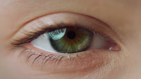 Macro-camera-motion-of-woman-eye-staring-at-camera.-Close-up-of-female-eye.