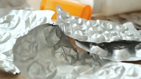 discarded and empty pill blister packs and medicine bottle