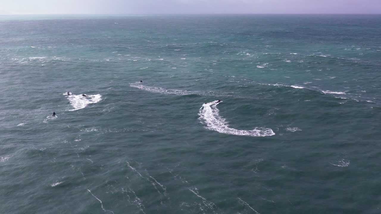Jet ski riders exploring high Nazaré energy ocean surface. Portugal, Europe, professional big wave tow-in surfing destination