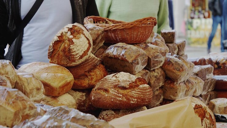 Fresh artisan bread displayed at a local market stall