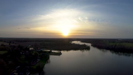 aerial drone footage on a sunset over a norfolk broad