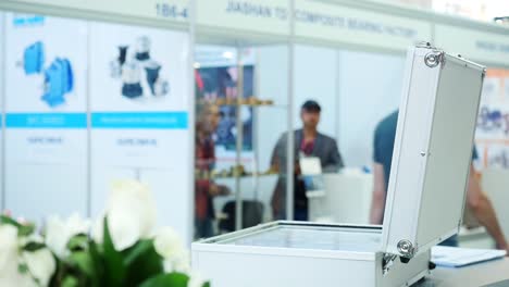 young man examining documents at trade show