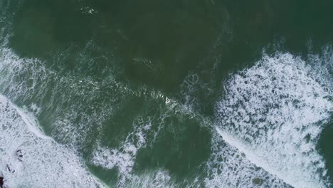 aerial view drone camera top down of seashore rocks in ocean beautiful sea surface amazing sea waves crashing on rocks seascape in phuket island thailand aerial view drone 4k high quality footage