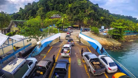 cars loaded on a ferry and headed for the island koh chang trat province of thailand