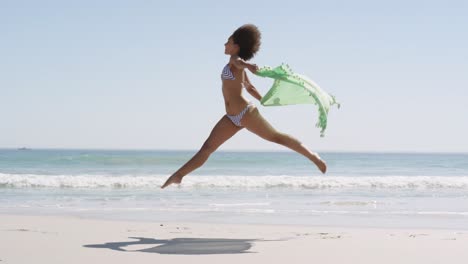 young woman running at the beach 4k